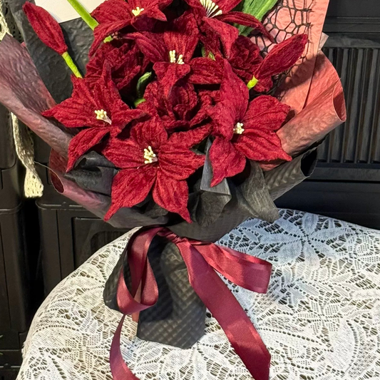 Burgundy Lily close-up showing handmade chenille flower texture, wrapping folds and ribbon details.