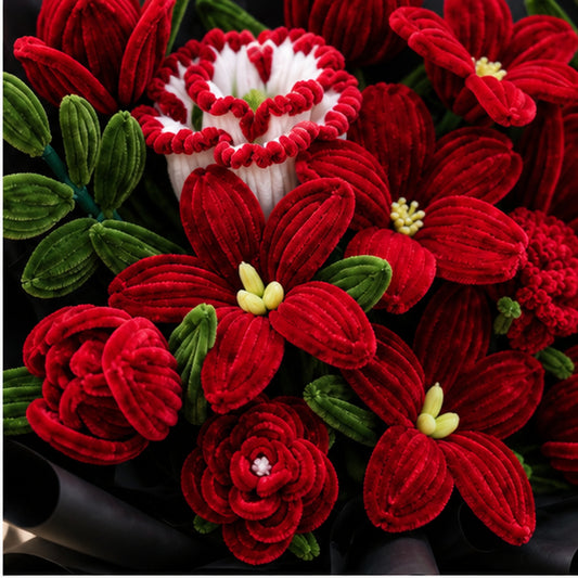 Close-up of the After Dark handmade chenille bouquet, showing textured crimson flowers, deep green foliage and black wrapping.