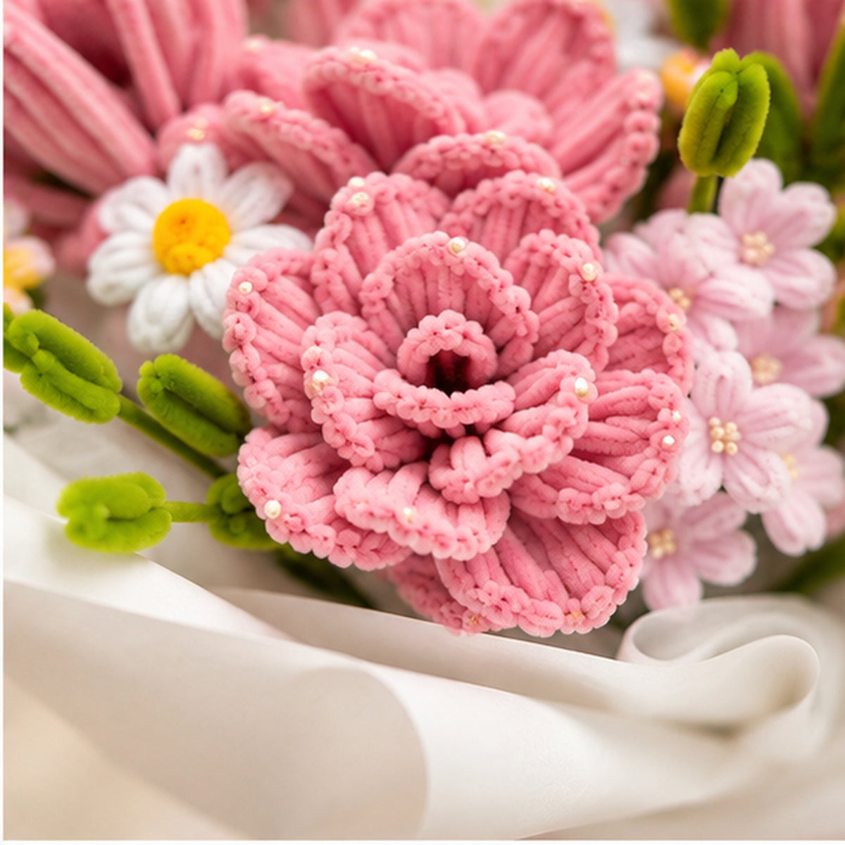 Close-up of the Memory Blush handmade chenille bouquet, showing textured pink peonies, white daisies and green buds.