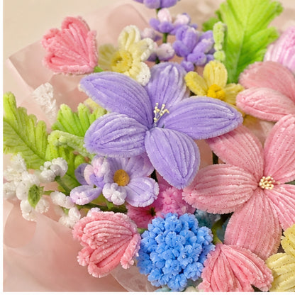 Close-up of the Modern Orchid handmade chenille bouquet, showing textured lavender, pink, yellow and blue flowers.