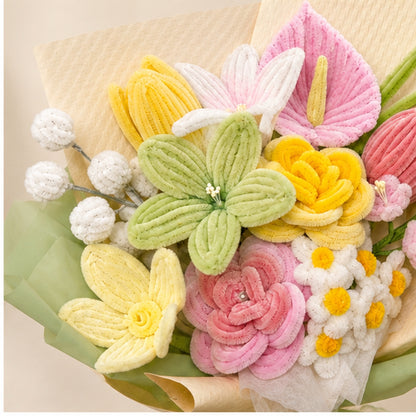 Close-up of the Enchanted Garden handmade chenille bouquet, showing textured pastel pink, yellow, green and ivory flowers.
