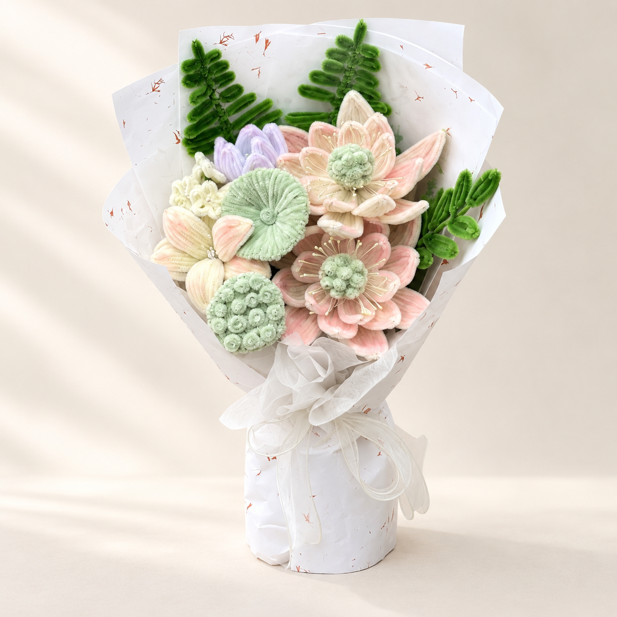 Mint Peach Reverie handmade chenille flower bouquet in its finished decorative wrapping.