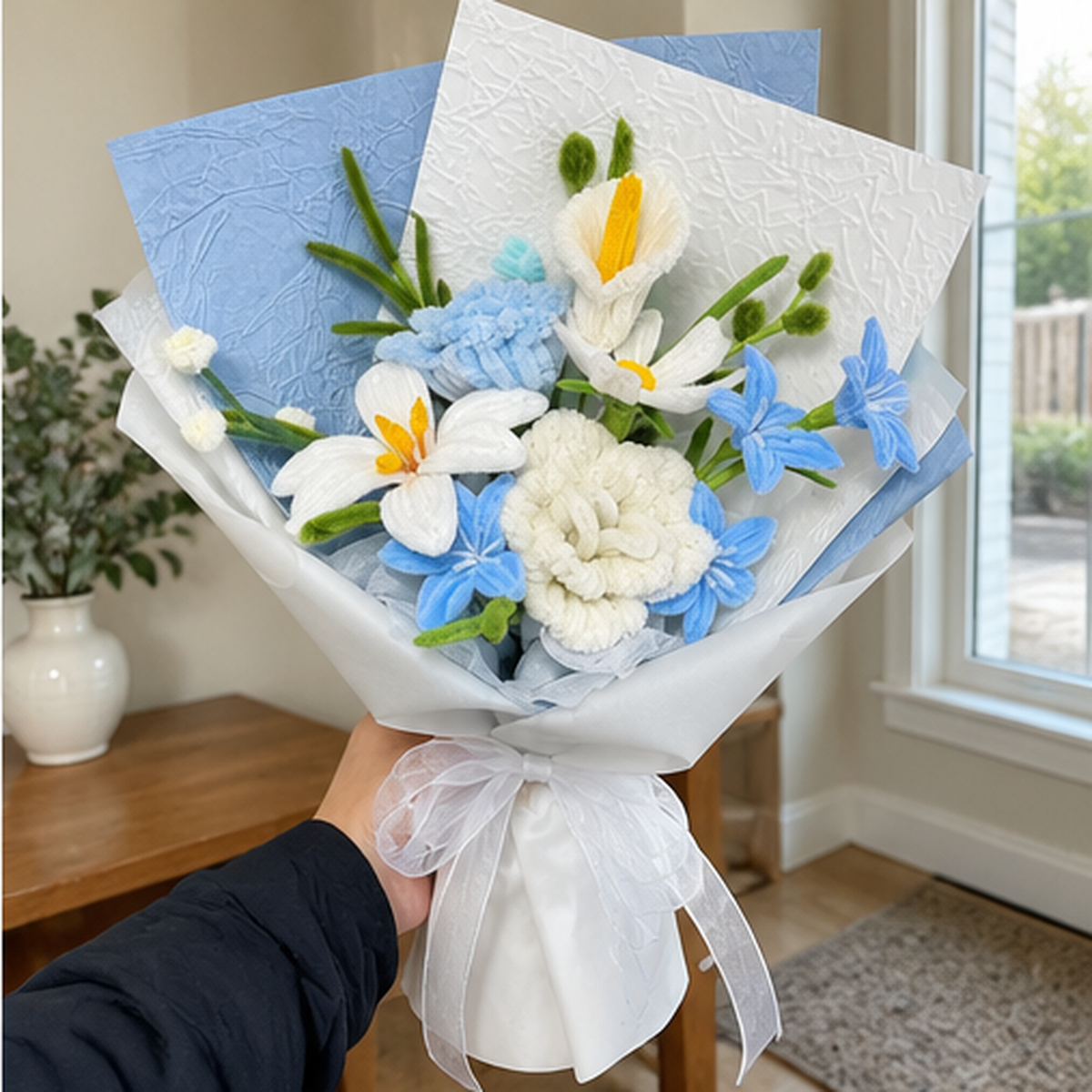 Azure Lily held naturally in a home gifting setting.