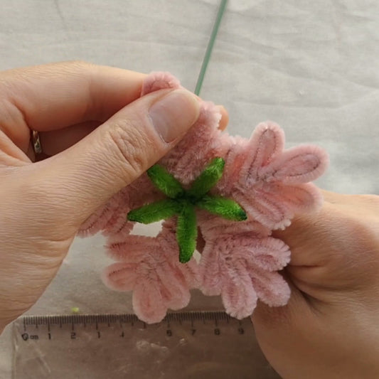 Pink chenille snowflake shown in the lesson